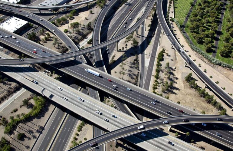 Aerial view of a complex multi-level highway interchange with traffic