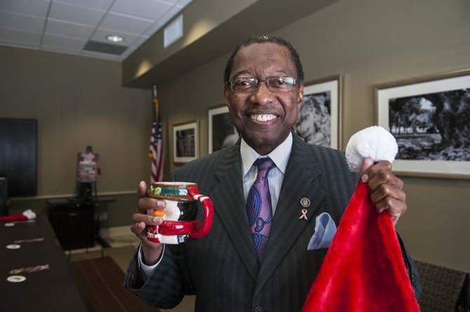 Mayor Melvin Kip Holden Holding a Cup